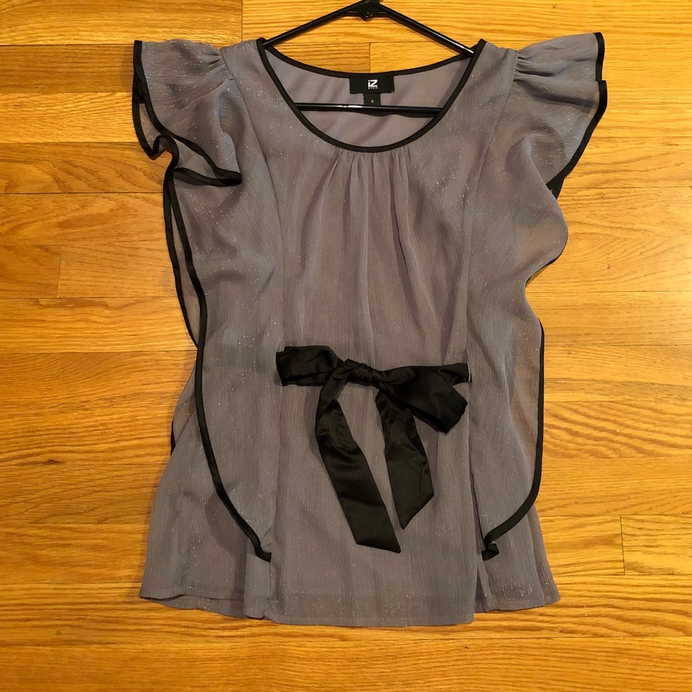 Very flattering black and silver glitter blouse.
